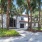 clubhouse exterior surrounded by palm trees