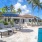 umbrella shaded lounge chairs beside pool
